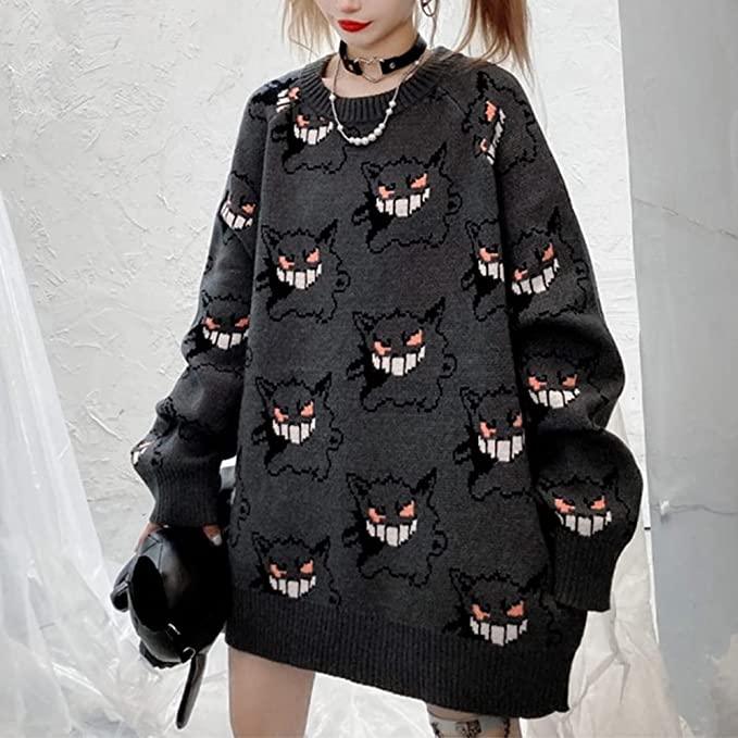woman wearing sweater with monster pattern