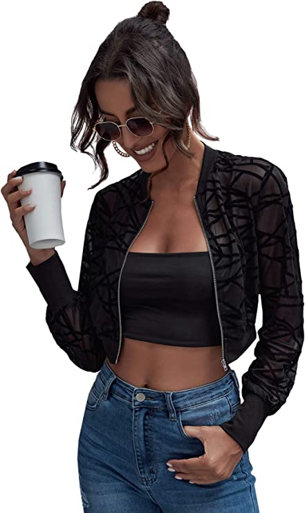 woman with coffee wearing short mesh black jacket